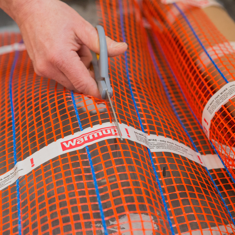 Warmup StickyMat Electric Underfloor Heating Mat being Cut