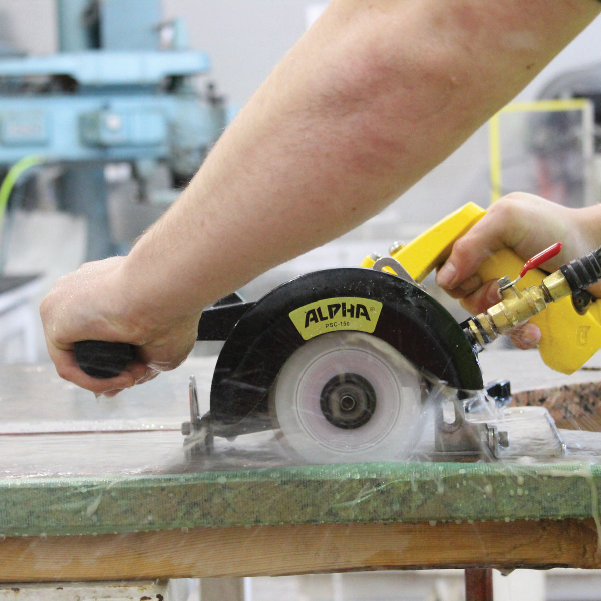 Action Shot of the Alpha psc-150 pneumatic stone cutter channel cutting 