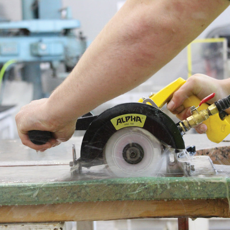 Action Shot of the Alpha psc-150 pneumatic stone cutter channel cutting 