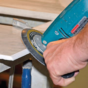 Person sanding a stone edge with  a Alpha sandpaper disc