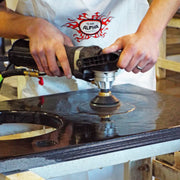 Person using the Alpha VSP-320 and Polishing pads to polish granite surface