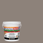 Prism SCG grout bucket on a walnut background