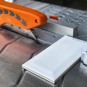 Contractor cutting tile with iQ Power Tools iQ228 Cyclone dry cut tile saw