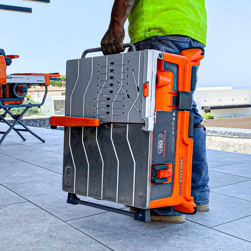 Contractor carrying the iQ Power Tools iQ228 Cyclone dry cut tile saw