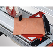 Raimondi Gladiator 105 41" Tile Saw with porcelain tile on the cutting table
