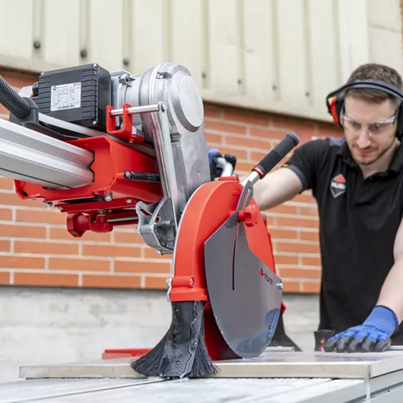 Action Shot of RUBI DX-350-N 1300 Laser & Level Wet Tile Saw, 58-1/2" cutting porcelain tile