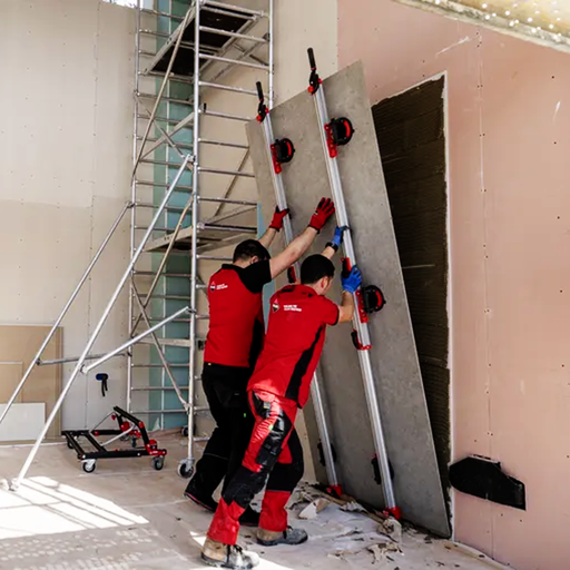 RUBI Ergonomic Large Format Tile Transport System being used to install a porcelain slab sheet on a wall